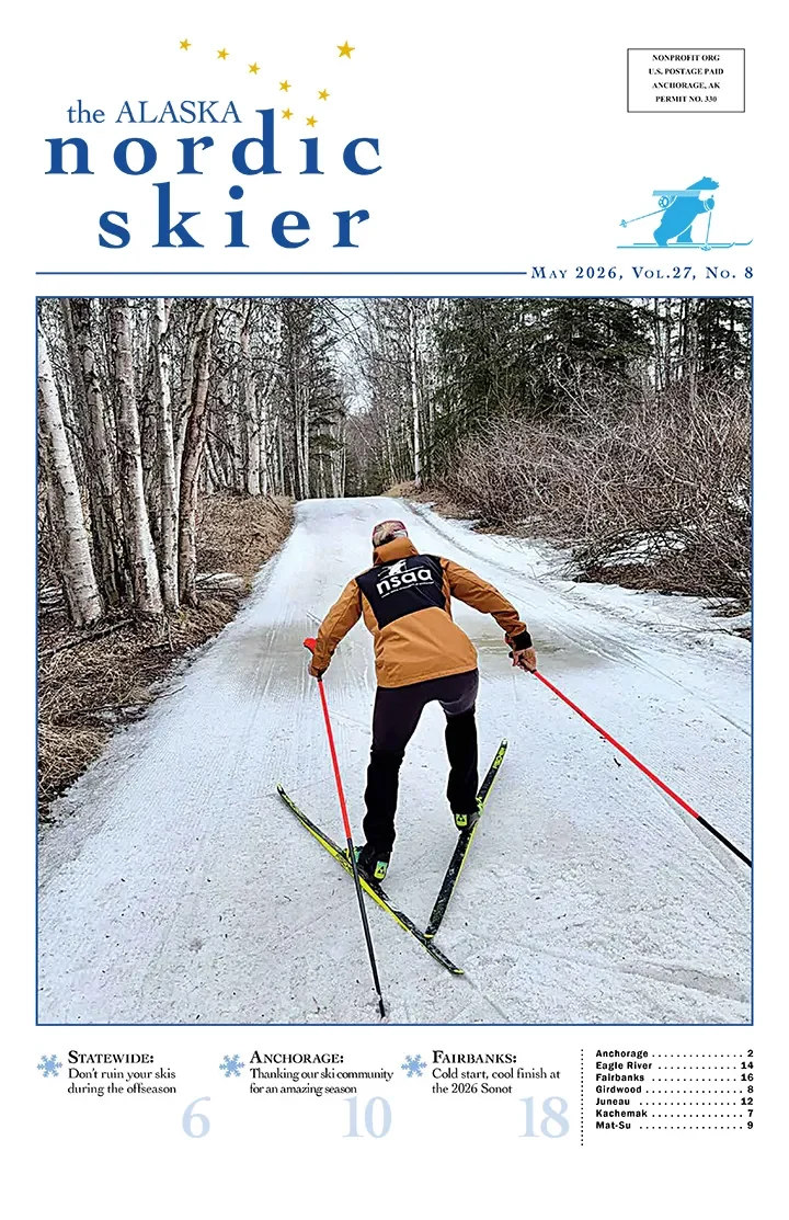 Cover of The Alaska Nordic Skier, May 2026, showing a skier in an orange jacket skate skiing down a birch-lined trail.